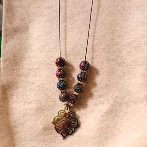 Purple and Green Beaded Necklace with Ornate Pendant